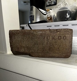 Iola Kansas history, Union Brick Company, antique vitrified brick, historic Iola brick, Kansas industrial history, Iola natural gas boom, local history artifact, The Drug Apostles, Iola Kansas band, sonic vandalism